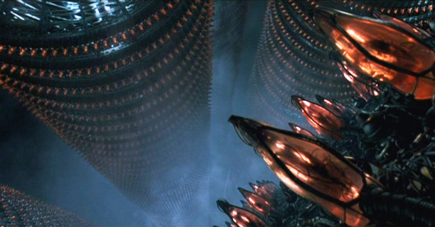 Screengrab from The Matrix (1999) showcasing the human farm that the machines use for energy harvesting.